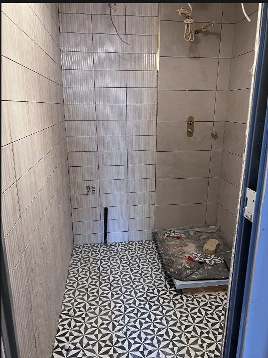 Wet room mid-tiling