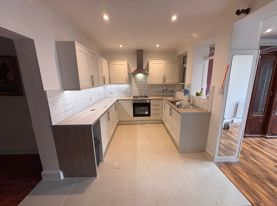 Open-plan kitchen view with island and gas hob