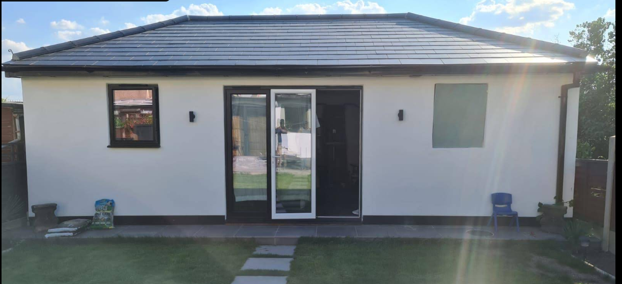 Rear house extension with sliding doors