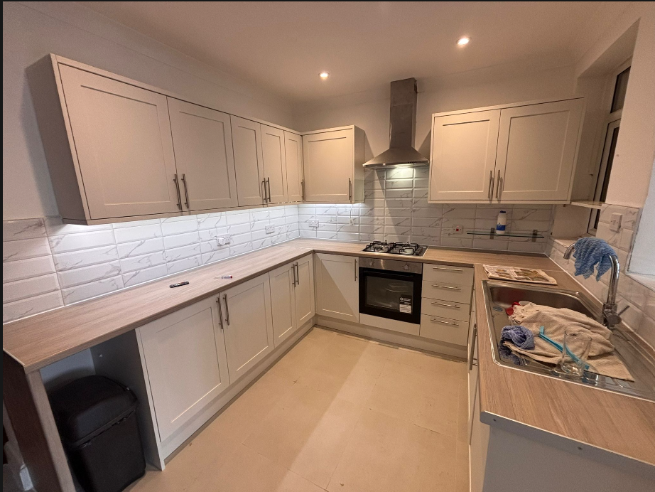 Fitted shaker kitchen with marble splashback